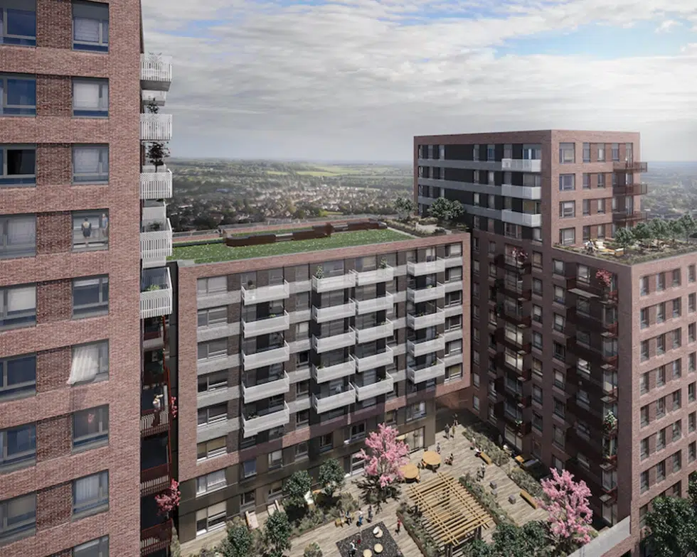 Modern apartment complex with rooftop garden and courtyard.